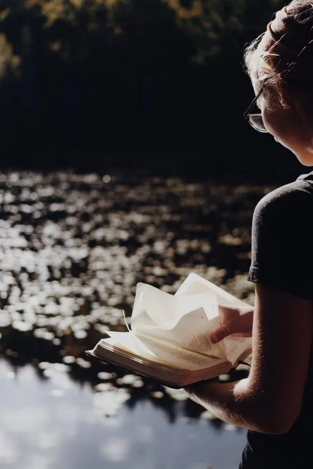 A woman reading in the morning light